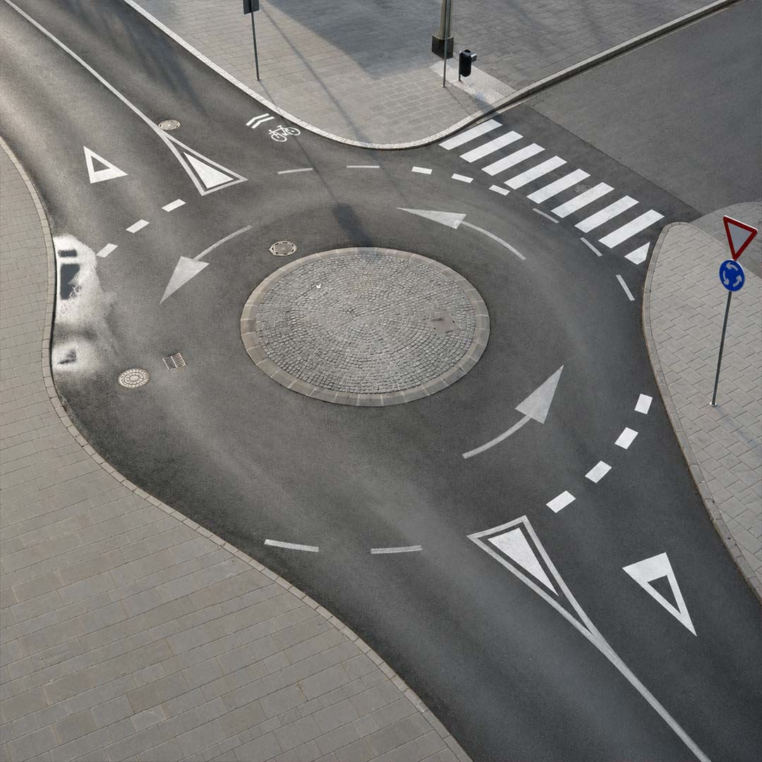 Aerial view of empty roundabout, clean road markings,