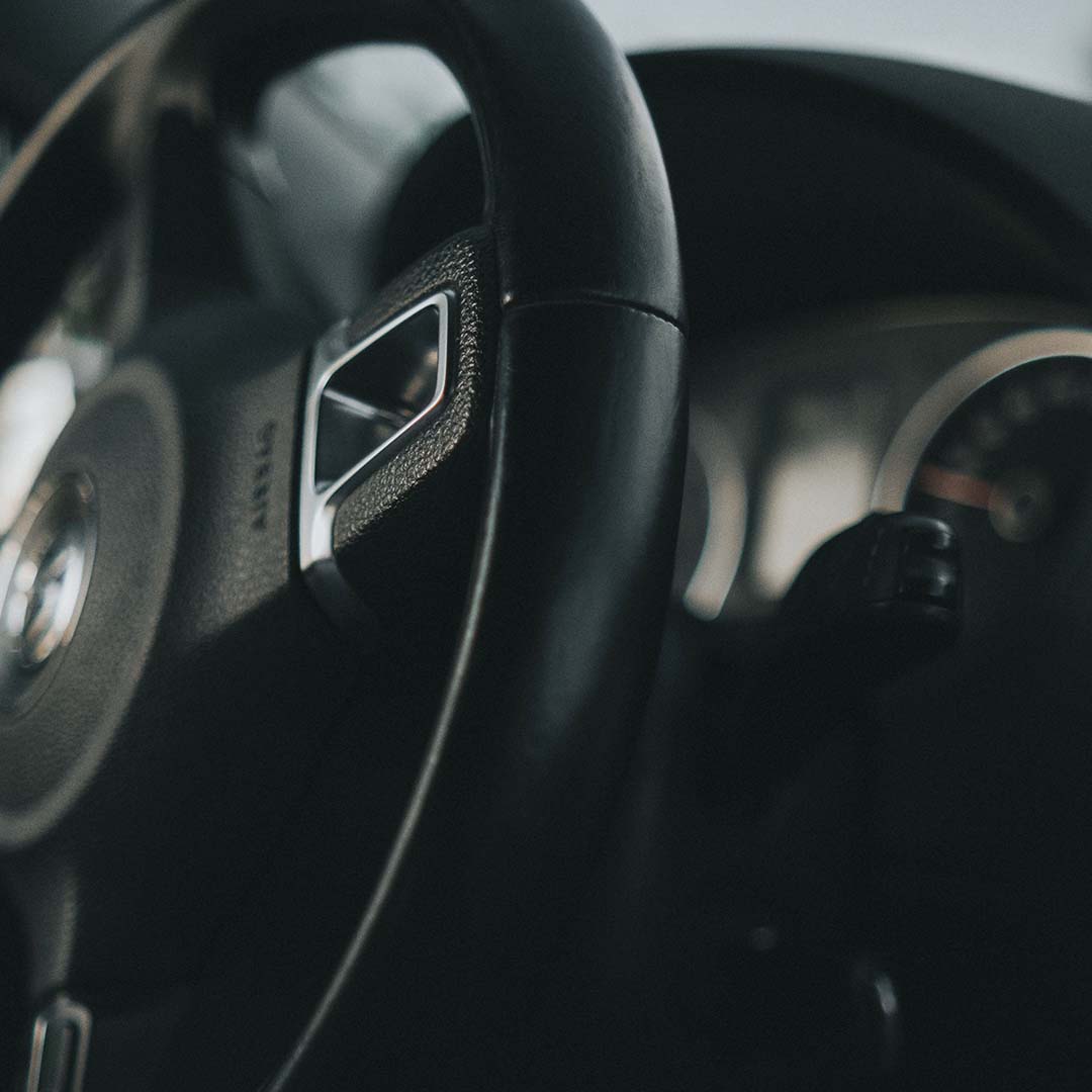 Close-up of car steering wheel and dashboard, (1) Close-up of car steering wheel and dashboard, (1)