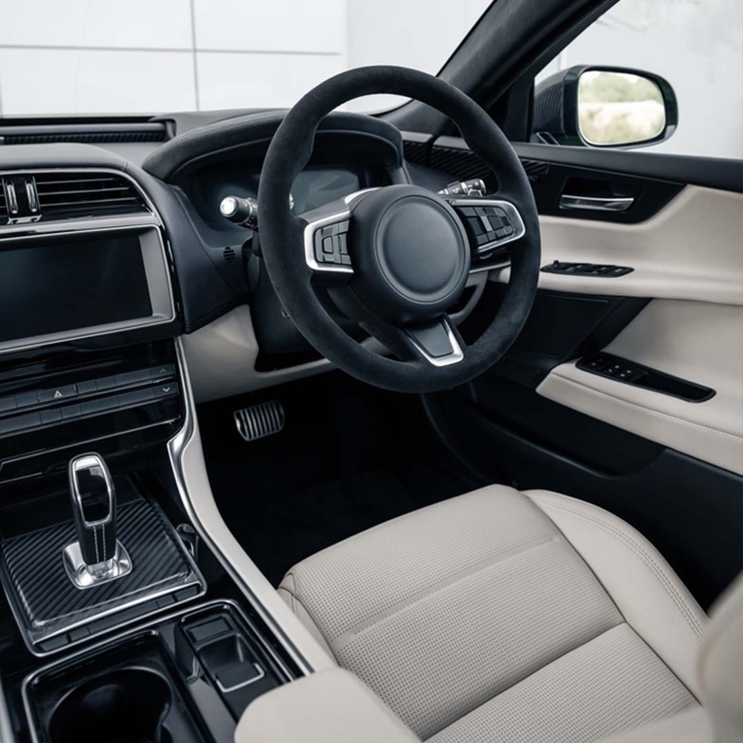Close-up of car steering wheel and dashboard,