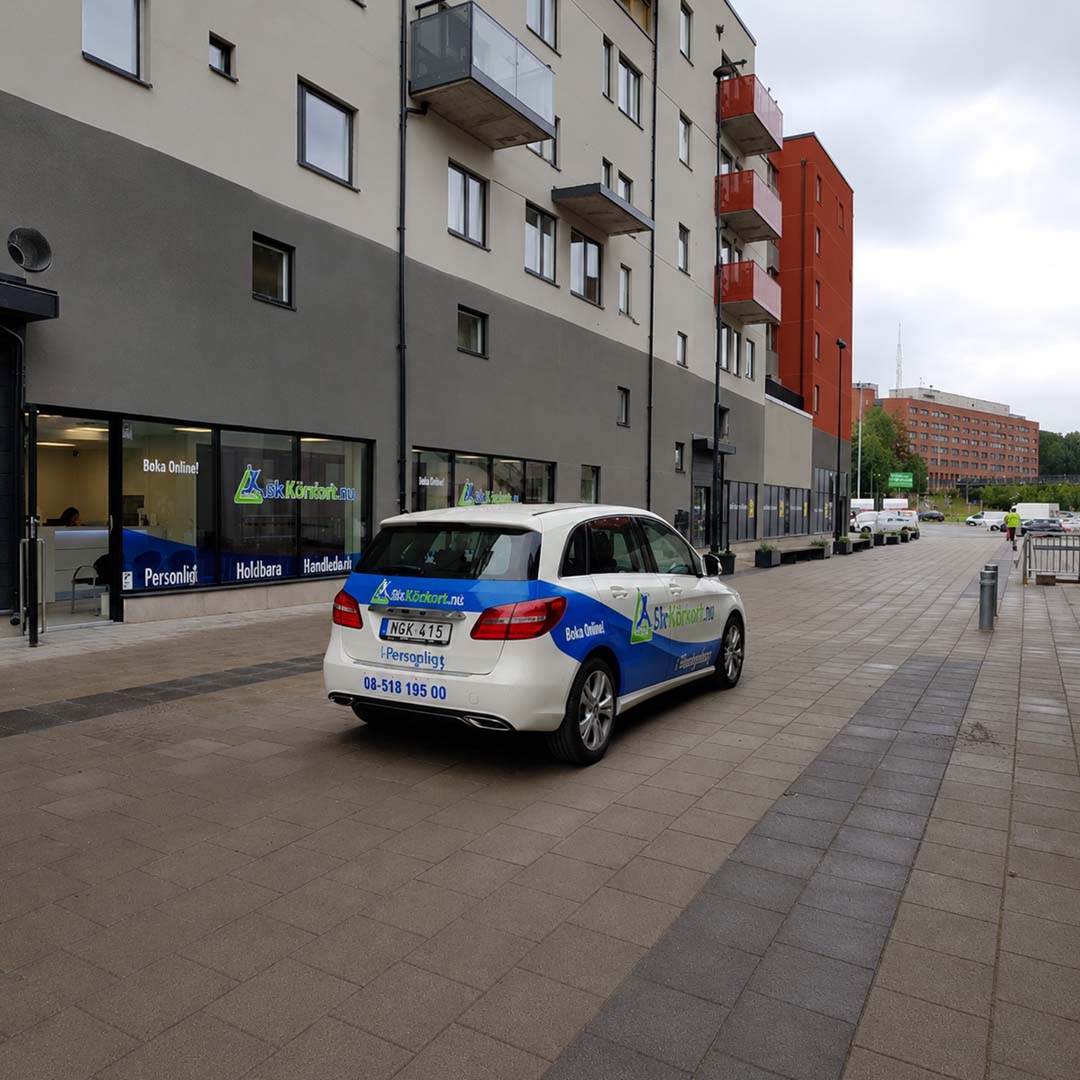 Driving school car parked on empty city