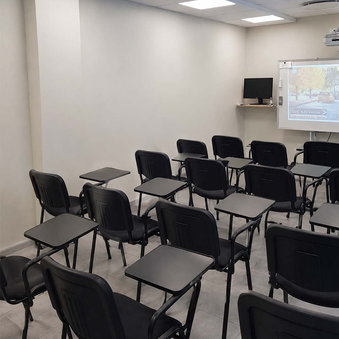 “Driving theory classroom setup with desks,