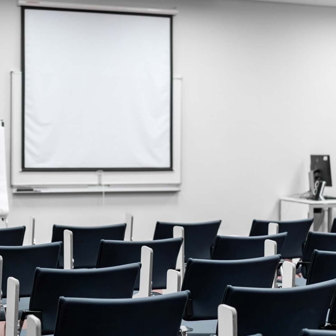 Empty modern classroom with chairs and a presentation