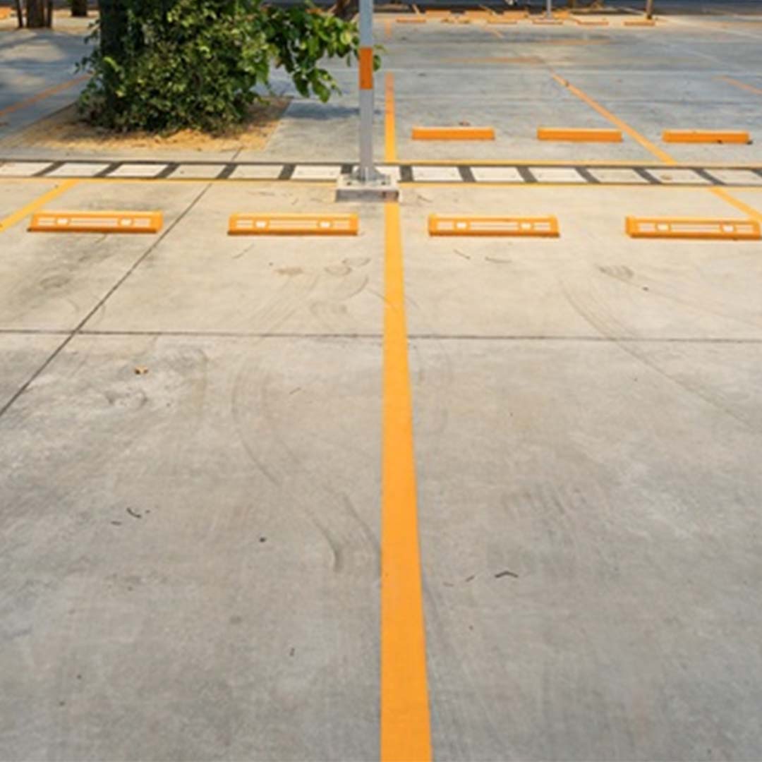 Large empty parking lot, clean road markings,