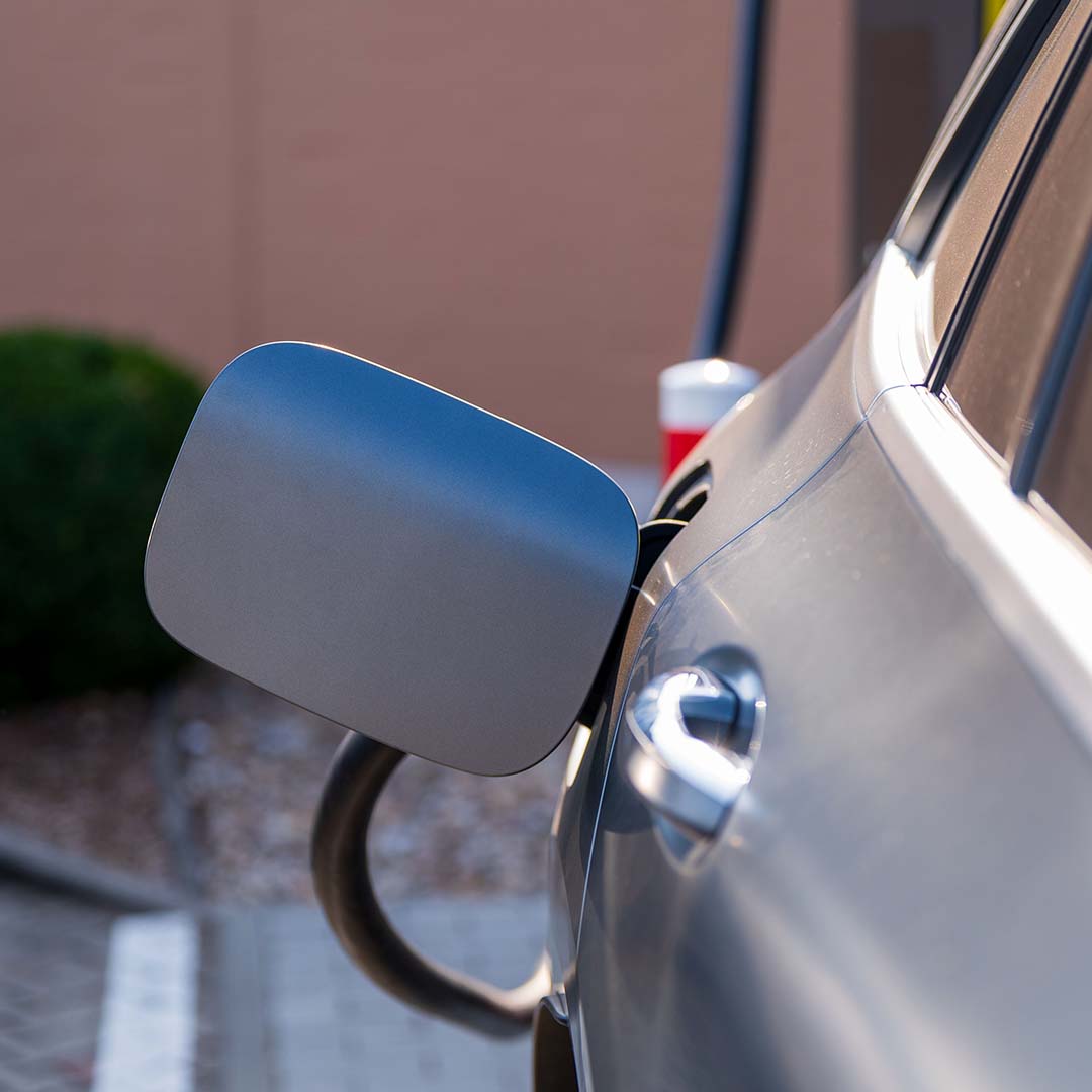 Modern electric car charging at station